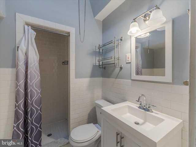 bathroom featuring tile walls, curtained shower, and vanity