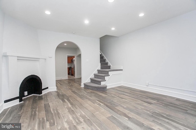 unfurnished living room with wood-type flooring