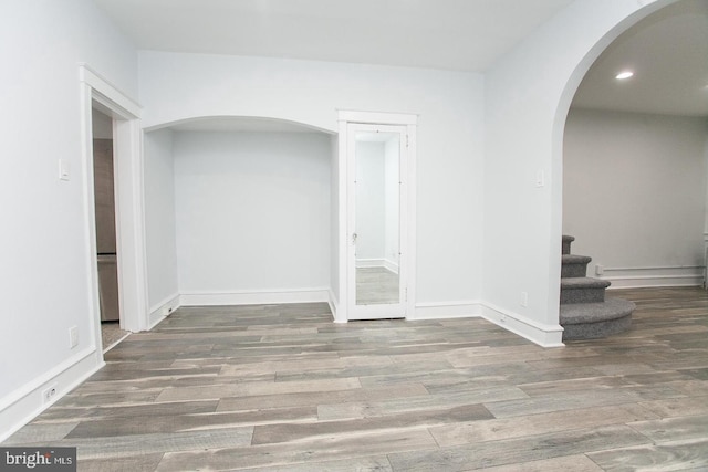 corridor featuring wood-type flooring