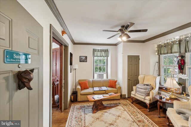 living room with hardwood / wood-style flooring, ceiling fan, and a healthy amount of sunlight