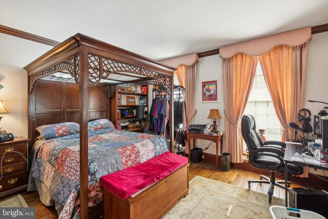 bedroom with light hardwood / wood-style floors