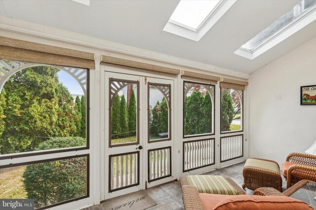 sunroom featuring vaulted ceiling