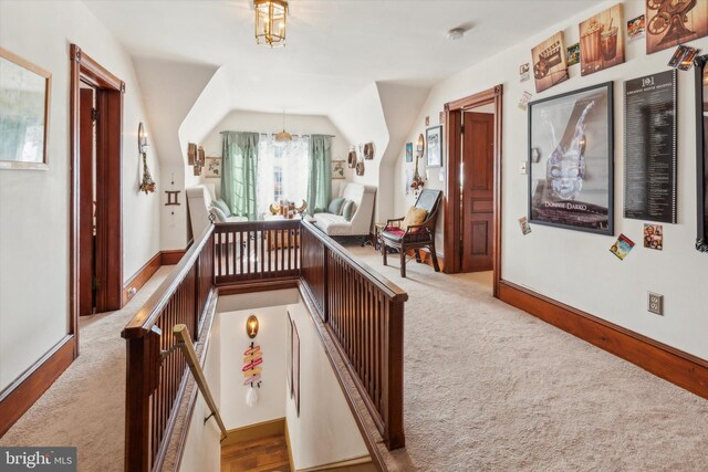 playroom with light colored carpet and vaulted ceiling