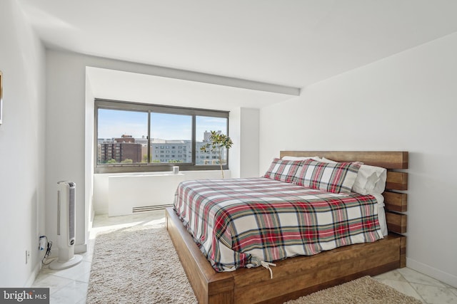 bedroom featuring light tile patterned floors