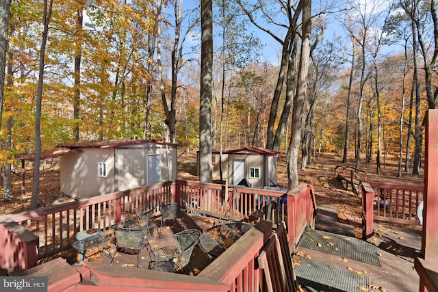 wooden terrace with a storage unit