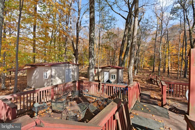 8600 Sapienza Dr, Fort Washington, MD 20744 - wooden terrace featuring an outbuilding and a storage unit