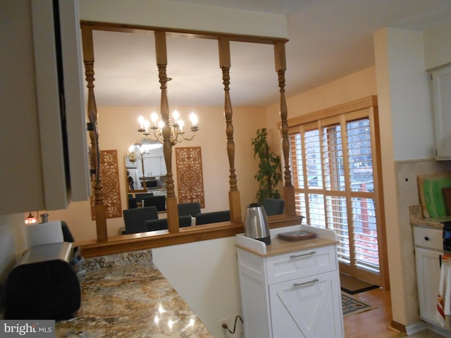 603 Bloomfield Dr, Westampton, NJ 08060 - kitchen with white cabinets, a chandelier, and decorative light fixtures