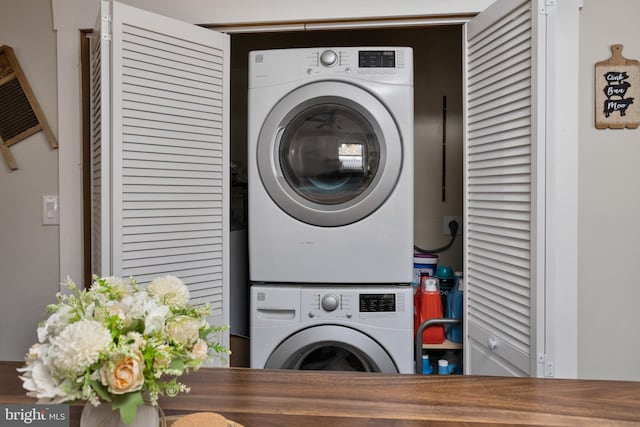 laundry area with stacked washer / drying machine