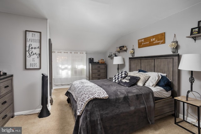 carpeted bedroom featuring lofted ceiling