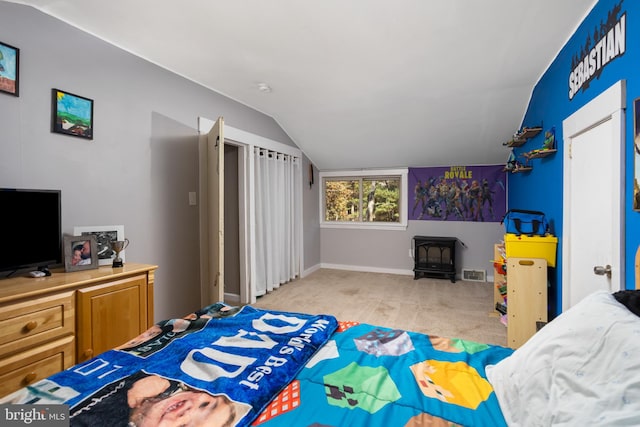 carpeted bedroom with vaulted ceiling