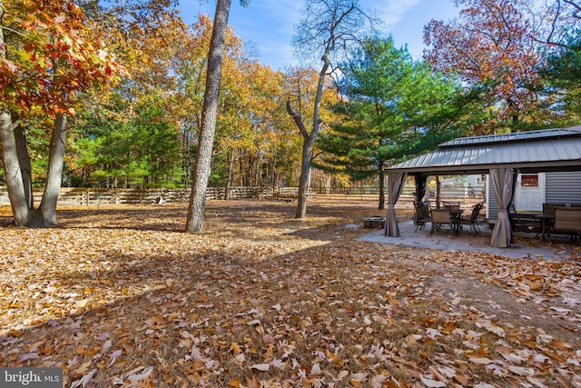 view of yard featuring a gazebo and a patio area