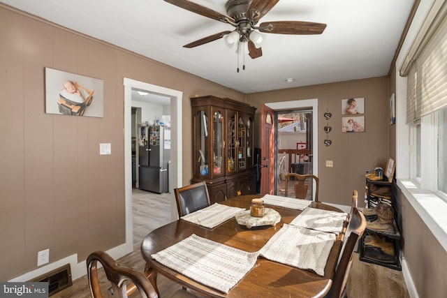 dining area with ceiling fan, light hardwood / wood-style floors, and plenty of natural light