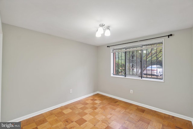 spare room with light parquet flooring