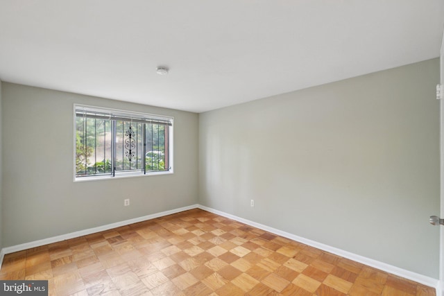 spare room with light parquet floors