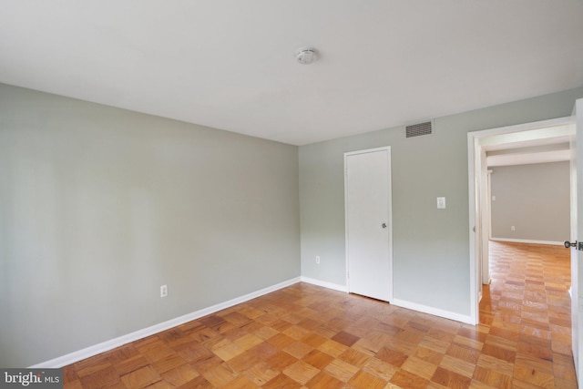 unfurnished bedroom with light parquet floors