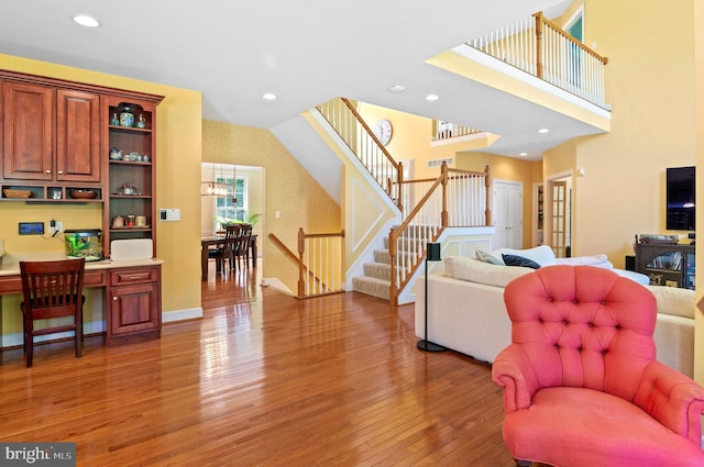 living room featuring hardwood / wood-style floors and built in desk