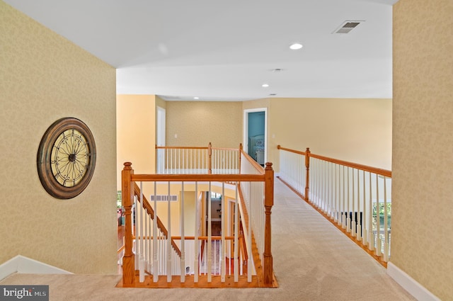 hallway with light carpet