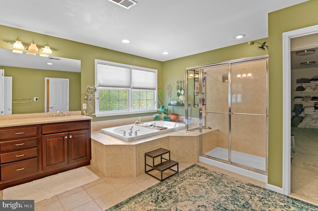 bathroom with vanity, shower with separate bathtub, and tile patterned flooring