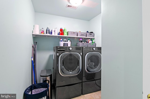 washroom featuring washer and clothes dryer