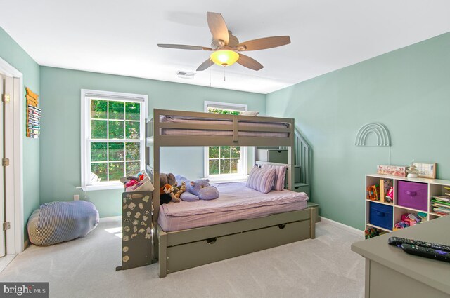 carpeted bedroom featuring ceiling fan