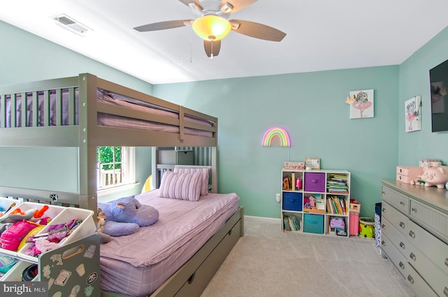 bedroom featuring light carpet and ceiling fan