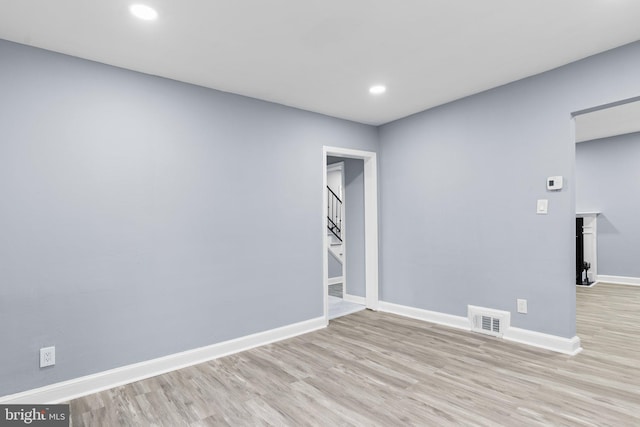 spare room with light wood-type flooring