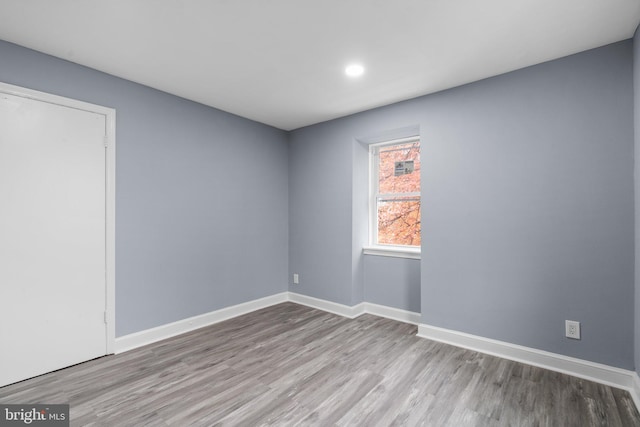 unfurnished room featuring light hardwood / wood-style floors