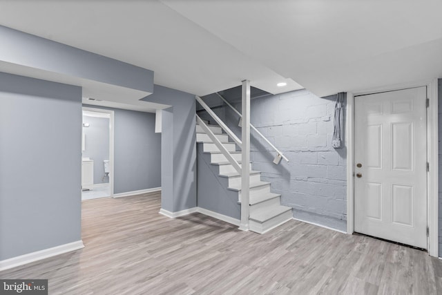 basement featuring light hardwood / wood-style floors