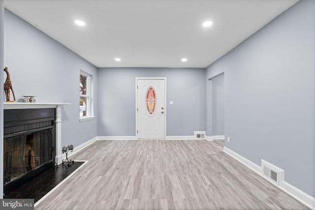 foyer entrance featuring hardwood / wood-style flooring