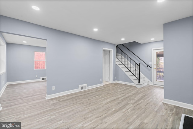 unfurnished living room with light wood-type flooring