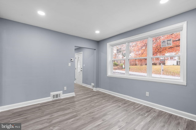 spare room with light hardwood / wood-style floors