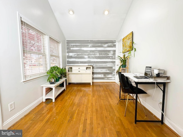 office featuring light wood-type flooring and lofted ceiling