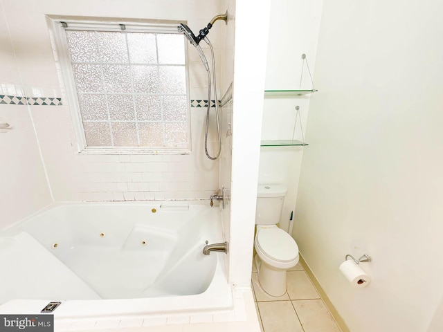 bathroom with toilet, tiled shower / bath combo, a wealth of natural light, and tile patterned floors