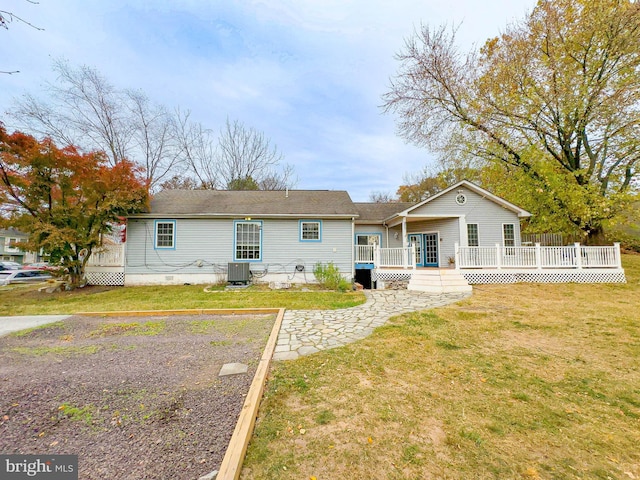 view of front of property featuring central AC unit, a front lawn, and a deck