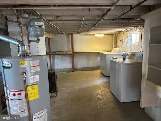 basement with gas water heater and washer and dryer