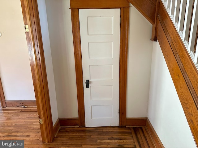 hall featuring dark wood-type flooring