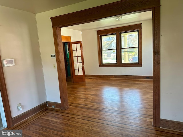 spare room featuring dark hardwood / wood-style floors