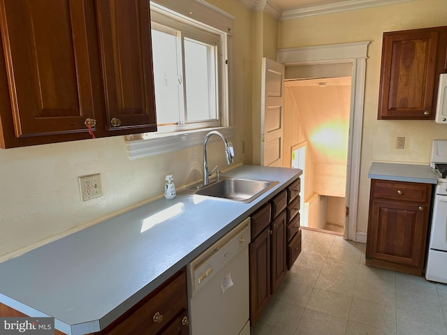 kitchen with ornamental molding, sink, white appliances, and light tile patterned floors