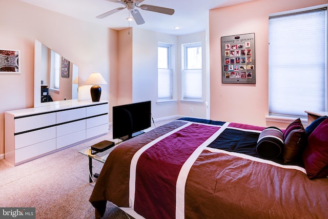 bedroom featuring ceiling fan and carpet floors