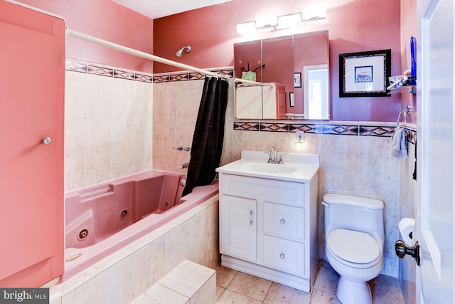 full bathroom with shower / bath combination with curtain, vanity, tile patterned floors, toilet, and tile walls