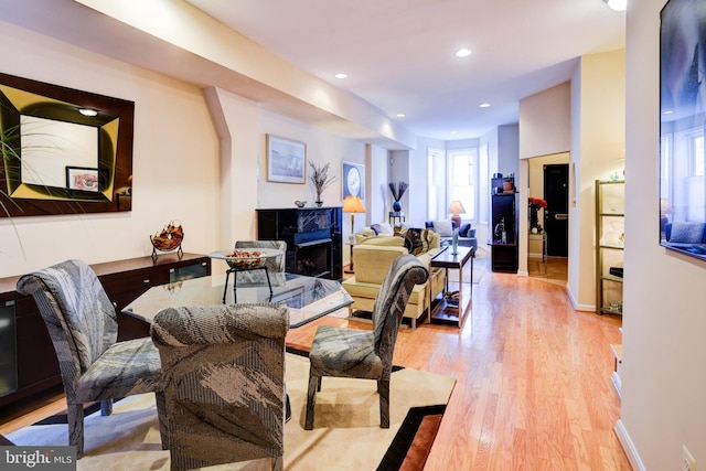 living room featuring a fireplace and light hardwood / wood-style floors