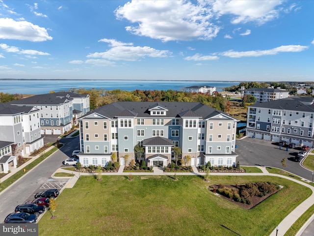 birds eye view of property with a water view