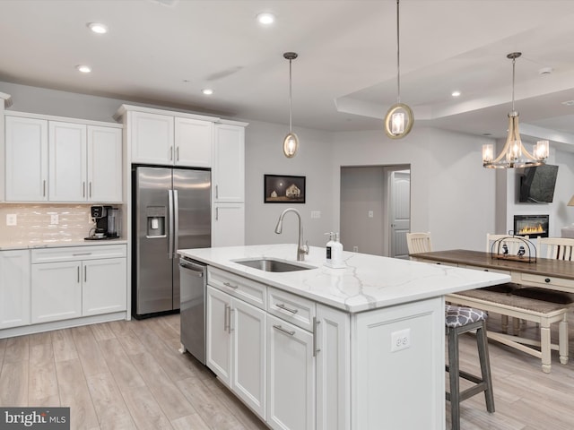 200 Harrier Way Unit 42, Chester, MD 21619 - kitchen with appliances with stainless steel finishes, a sink, recessed lighting, white cabinets, and light wood finished floors