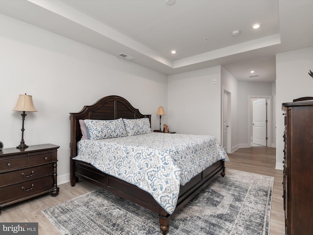200 Harrier Way Unit 42, Chester, MD 21619 - bedroom featuring light wood-style flooring, recessed lighting, baseboards, and a tray ceiling