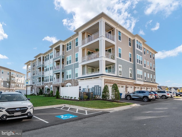 200 Harrier Way Unit 42, Chester, MD 21619 - view of apartment building / complex with uncovered parking and central AC unit