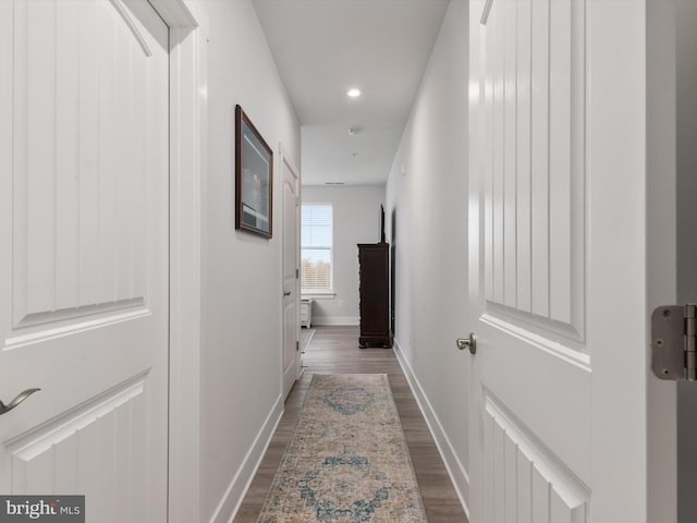 corridor featuring dark wood-type flooring