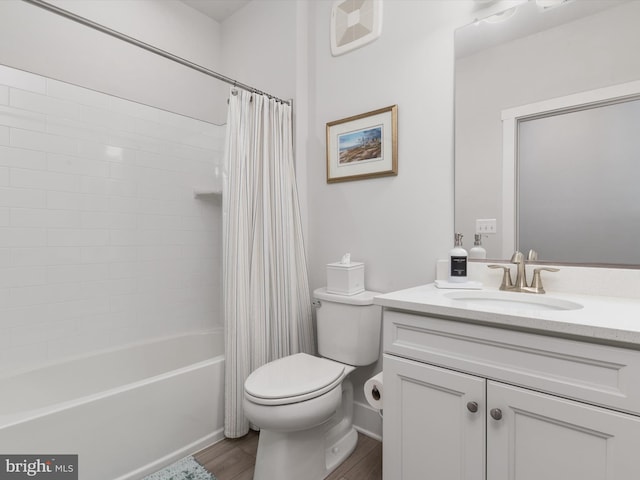 full bathroom featuring shower / bath combination with curtain, vanity, hardwood / wood-style flooring, and toilet