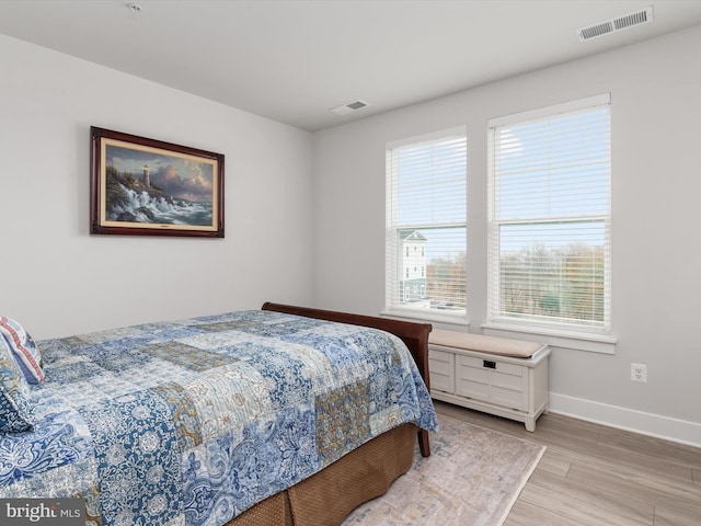 bedroom with light wood-type flooring