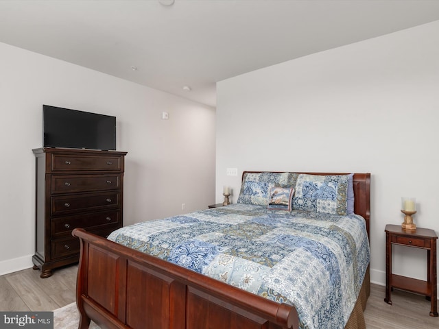 bedroom with light hardwood / wood-style floors