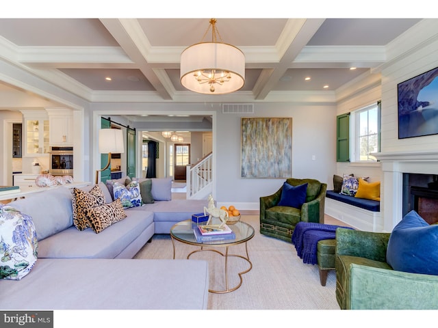 living room featuring a chandelier, beam ceiling, crown molding, and coffered ceiling